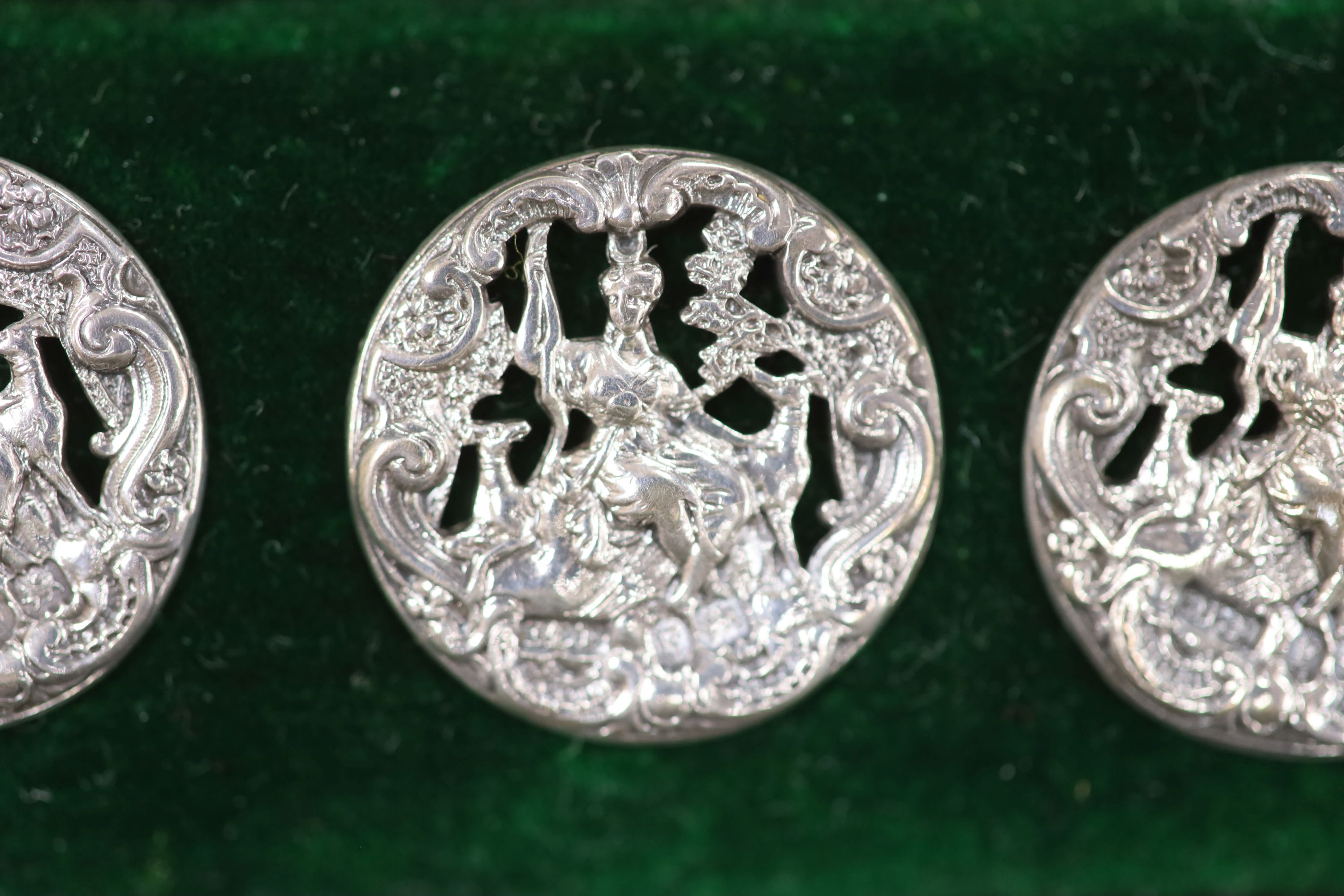A set of six Victorian silver buttons, cased, depicting Diana the Huntress